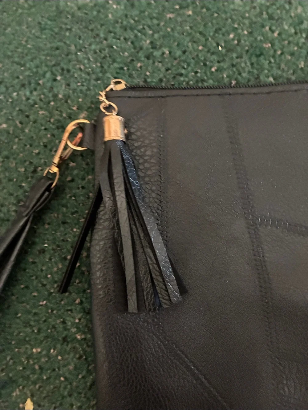 Ole Henriksen black leather